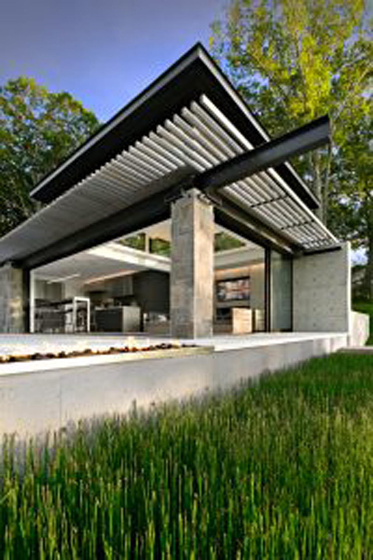 A contemporary pool house designed by Nautilus Architects, known for having the most beautiful pools and pool houses in CT