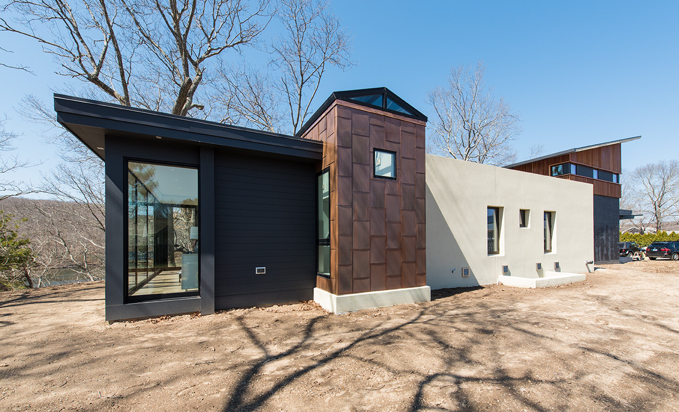 Nautilus Architects designs with Tesla roof tiles as seen on the contemporary Home the Crows Nest on the Long Island Sound